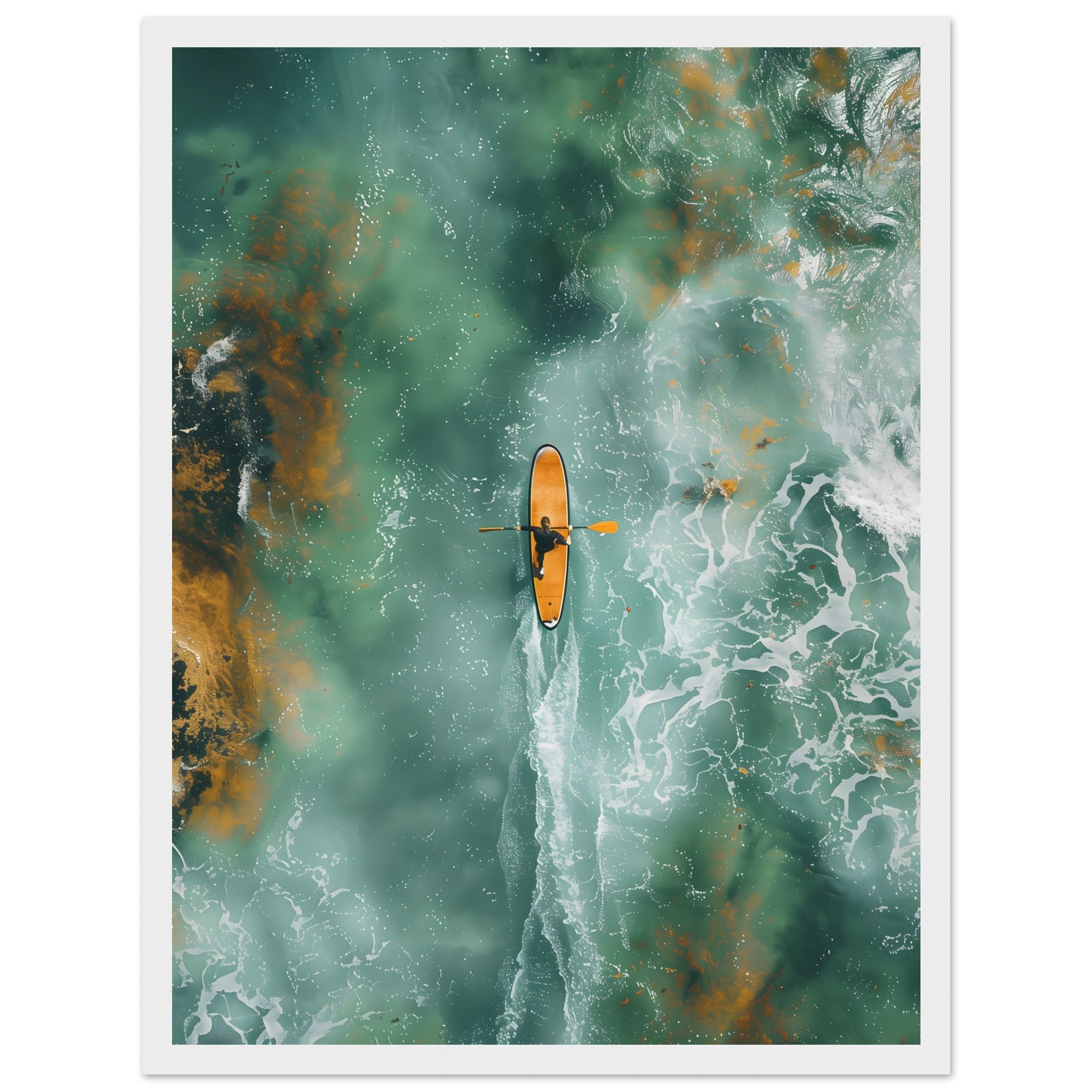 Gerahmtes Wandbild: Luftaufnahme eines SUP Boarders im türkis-orangen Ozean. weißer Holzrahmen.